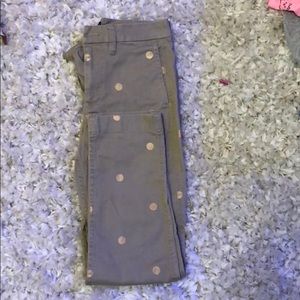 Full length tan pants with gold dots.